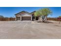Expansive desert home with three-car garage, stone accents, desert landscaping, and ample parking at 30511 N 162Nd Way, Scottsdale, AZ 85262