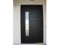 Sleek, black modern front door with a glass pane at 34449 N Elk Run Rd, San Tan Valley, AZ 85143