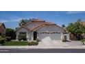 Inviting single-level home with desert landscaping, a two-car garage, and a classic Southwestern design at 6732 W Sack Dr, Glendale, AZ 85308