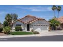 Charming single-story home featuring a well-maintained yard, desert landscaping, and a two-car garage at 6732 W Sack Dr, Glendale, AZ 85308