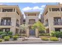 Exterior view of a building with manicured landscaping and decorative architectural features at 7601 E Indian Bend Rd # 3030, Scottsdale, AZ 85250