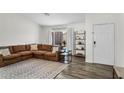 Inviting living room with a cozy sectional sofa, decorative shelving, and a bright, open atmosphere at 1320 E Scott Ave, Gilbert, AZ 85234