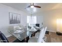 Bright dining room with modern table, seating for six and a ceiling fan at 1322 W Flower St, Phoenix, AZ 85013