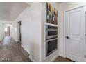 Galley kitchen with stainless steel appliances and white shaker cabinets at 1322 W Flower St, Phoenix, AZ 85013