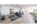 Spacious open-concept living area with kitchen, tile flooring, and modern furniture at 1322 W Flower St, Phoenix, AZ 85013