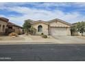 Inviting single-story home with a well-manicured front yard and desert landscaping at 14380 W Monte Vista Rd, Goodyear, AZ 85395