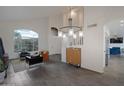 Bright living room featuring high ceilings, staircase, hardwood flooring and large windows offering plenty of natural light at 15421 S 16Th Dr, Phoenix, AZ 85045