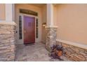 Charming entryway featuring a secure screen door and decorative stone accents at 1555 E Monterey St, Chandler, AZ 85225