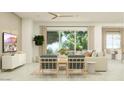 Inviting living room with large windows, comfortable seating, and stylish accents at 17411 W Swayback Pass, Surprise, AZ 85387