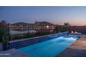 Backyard pool with mountain and lake views at 18135 W Hope Dr, Goodyear, AZ 85338