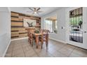 Dining room with unique wood accent wall and a table with seating for six at 2405 W Memorial Dr, Anthem, AZ 85086
