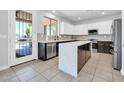 Bright kitchen with stainless steel appliances and an island with sleek countertops at 2405 W Memorial Dr, Anthem, AZ 85086