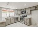 Beautifully updated kitchen featuring stainless steel appliances and granite countertops at 2605 E Fountain St, Mesa, AZ 85213