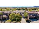Expansive aerial view showcases the home's setting within a beautifully landscaped community at 4497 E Carriage Way, Gilbert, AZ 85297