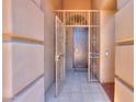 View of the front door behind a gated entry at 4560 E Paso Trl, Phoenix, AZ 85050