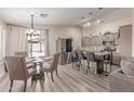 Inviting open-concept kitchen and dining area with stainless steel appliances and modern finishes at 5526 W Ellis Dr, Laveen, AZ 85339