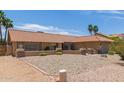 Charming single-story home featuring desert landscaping, a clay roof, and a desert style color scheme at 6073 E Beck Ln, Scottsdale, AZ 85254
