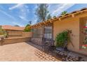 This lovely patio features an outdoor seating area and desert landscaping and is perfect for relaxing and enjoying the outdoors at 6073 E Beck Ln, Scottsdale, AZ 85254