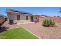 Private backyard with a covered patio and low-maintenance landscaping at 645 W Kingman Loop, Casa Grande, AZ 85122