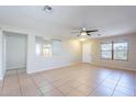 Spacious living room with ceramic tile floors and a ceiling fan at 645 W Kingman Loop, Casa Grande, AZ 85122