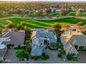 Stunning aerial view of the beautiful home overlooking a lush golf course at 9878 N 79Th Pl, Scottsdale, AZ 85258