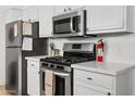 Close up of the kitchen features stainless steel appliances and white countertops at 1111 E Turney Ave # 3, Phoenix, AZ 85014