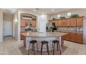 Spacious kitchen featuring a large island, stainless steel appliances, and ample countertop space at 18226 W Stinson Dr, Surprise, AZ 85374