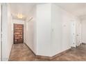 Welcoming foyer with tile flooring, a decorative wood front door, and neutral wall paint at 2019 W Stella Ln, Phoenix, AZ 85015