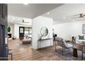 Bright living space with light wood floors, open layout, and modern furnishings at 2156 E Cairo Dr, Tempe, AZ 85282
