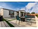 Relaxing backyard with a seating area and a fire pit, perfect for outdoor enjoyment at 23503 S 228Th Pl, Queen Creek, AZ 85142