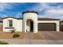 Charming single-story home featuring a unique turret entry, tile roof, and attached two-car garage at 23503 S 228Th Pl, Queen Creek, AZ 85142