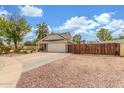 Spacious property with a long driveway, RV gate, and a two-car garage, perfect for outdoor living at 2508 N Karen Dr, Chandler, AZ 85224