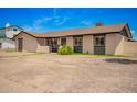 Charming single-story home featuring stucco siding, dark trim, and a low-maintenance desert landscape at 2826 E Cactus Rd, Phoenix, AZ 85032
