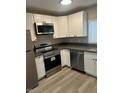 Well-equipped kitchen with modern appliances and sleek countertops at 286 W Palomino Dr # 105, Chandler, AZ 85225