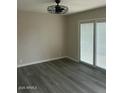 Spacious living room with sliding glass doors for natural light at 286 W Palomino Dr # 105, Chandler, AZ 85225