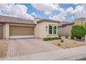 Charming single-story home with a well-manicured front yard and a two-car garage at 36047 N Copper Hollow Way, Queen Creek, AZ 85140