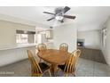 Dining area featuring wooden table and chairs adjacent to the kitchen at 4533 W Cavalier Dr, Glendale, AZ 85301