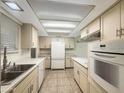 Bright kitchen featuring neutral cabinets, countertops, and appliances at 4533 W Cavalier Dr, Glendale, AZ 85301