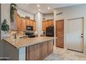 Well-appointed kitchen with granite countertops, wooden cabinets, and modern appliances at 490 W Encinas St, Gilbert, AZ 85233