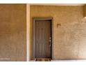 Inviting front door with a warm welcome mat and unit number 1004 at 5401 E Van Buren St # 1004, Phoenix, AZ 85008