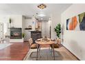 Charming dining area featuring a modern chandelier and breakfast bar with a stone facade at 6900 E Princess Dr # 2247, Phoenix, AZ 85054