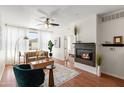 Inviting living room with a modern fireplace, stylish furniture, and a ceiling fan for comfort at 6900 E Princess Dr # 2247, Phoenix, AZ 85054