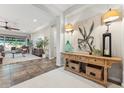 Inviting foyer with a wooden console table, leading to a spacious living area with comfortable seating at 7503 S Roanoke St, Gilbert, AZ 85298