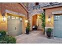Inviting front entrance featuring a charming archway, stone accents, and a well-manicured walkway at 7503 S Roanoke St, Gilbert, AZ 85298