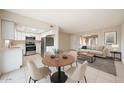 Open-concept living area with modern appliances and a dining area at 8023 N 49Th Ave, Glendale, AZ 85302