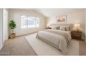 Spacious main bedroom featuring a large window and neutral decor at 8023 N 49Th Ave, Glendale, AZ 85302