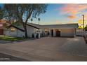 Charming single-Gathering home featuring a spacious driveway and an inviting covered entry, perfect for a growing Gathering at 8315 E Devonshire Ave, Scottsdale, AZ 85251