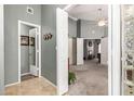 Open foyer with tile flooring and multiple doorways to living spaces at 1214 W Sand Dune Dr, Gilbert, AZ 85233