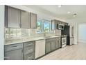 Modern kitchen with granite counters, stainless steel appliances, and ample cabinet space at 1930 E Missouri Ave, Phoenix, AZ 85016