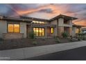 Modern home with sleek architecture and professionally landscaped front yard at 24138 S 220Th St, Queen Creek, AZ 85142
